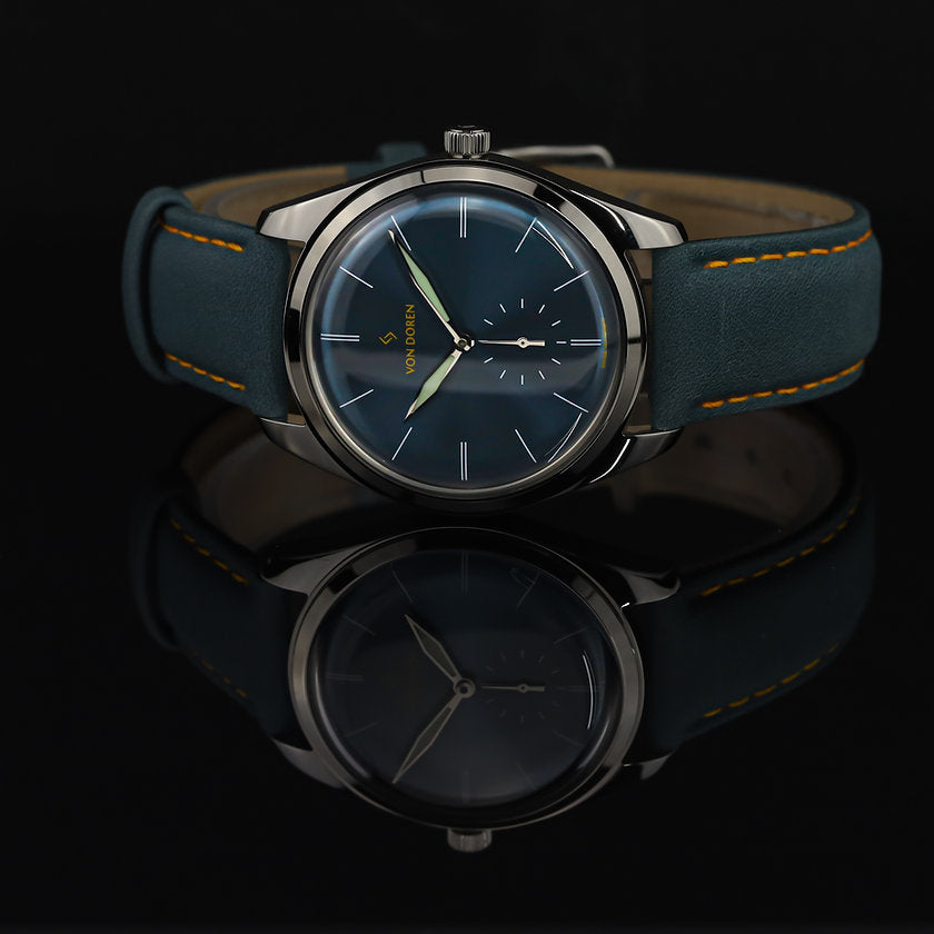 Von Doren klokke. Modell Runde Steel Blue speiler seg.