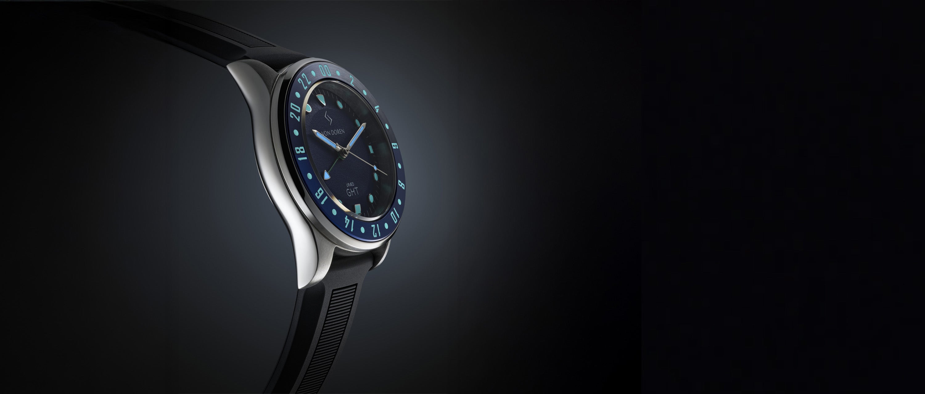 Von Doren URÆD GMT watch with blue dial and 24-hour bezel shown against a dark background.
