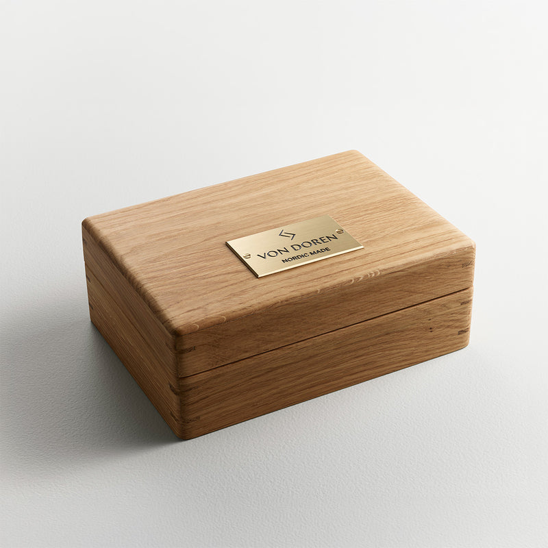 Handmade oak presentation box from Von Doren with engraved brass plaque and Nordic minimalist design.