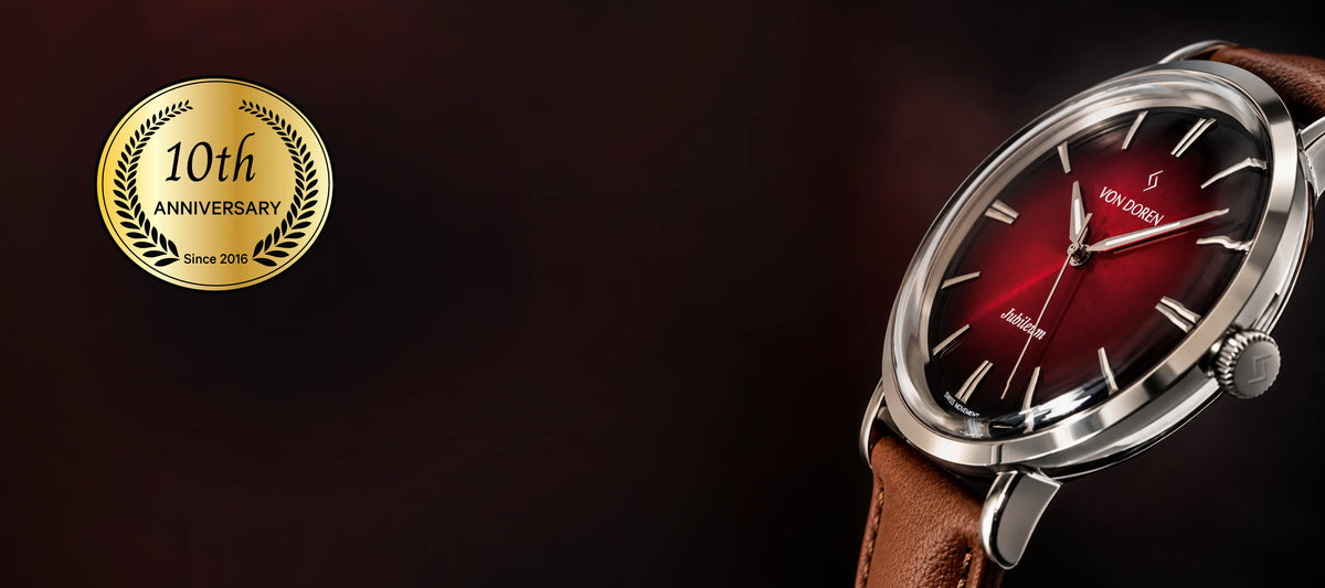 Von Doren Aksla Jubileum with a ruby red dial, polished stainless steel case and brown leather strap. An elegant watch inspired by Ålesund.