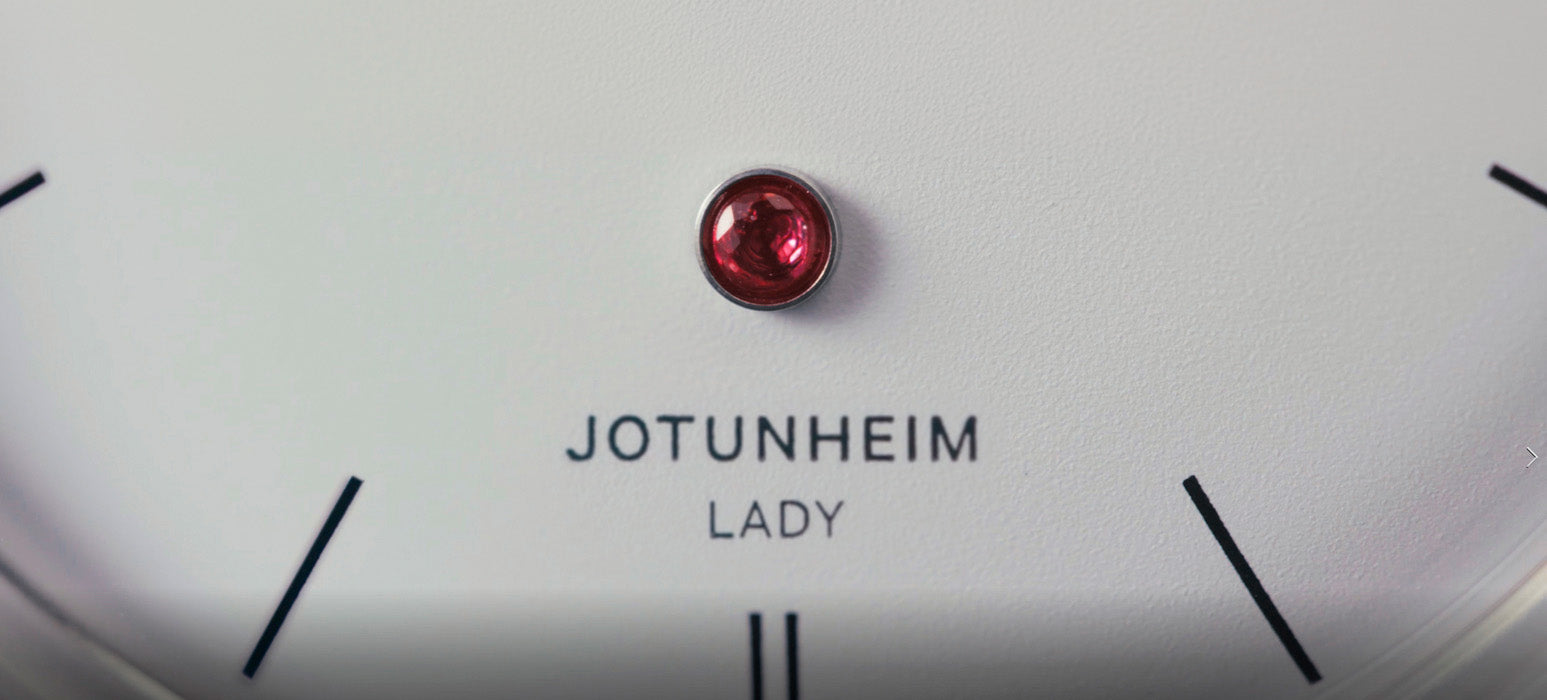 Close-up of the Jotunheim Lady watch dial with a red gemstone at 6 o’clock.
