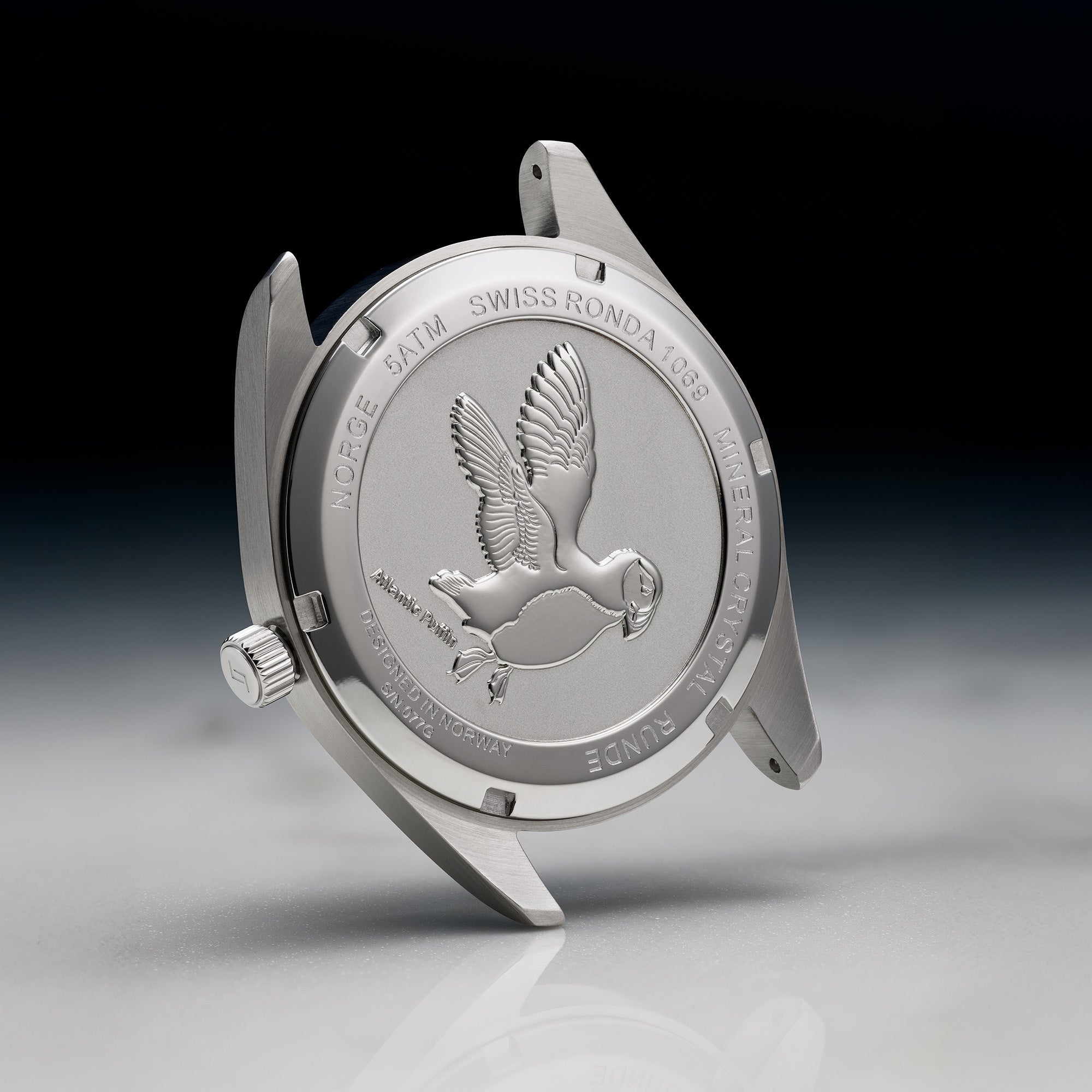 Von Doren baklokk til klokke, preget med en lundefugl