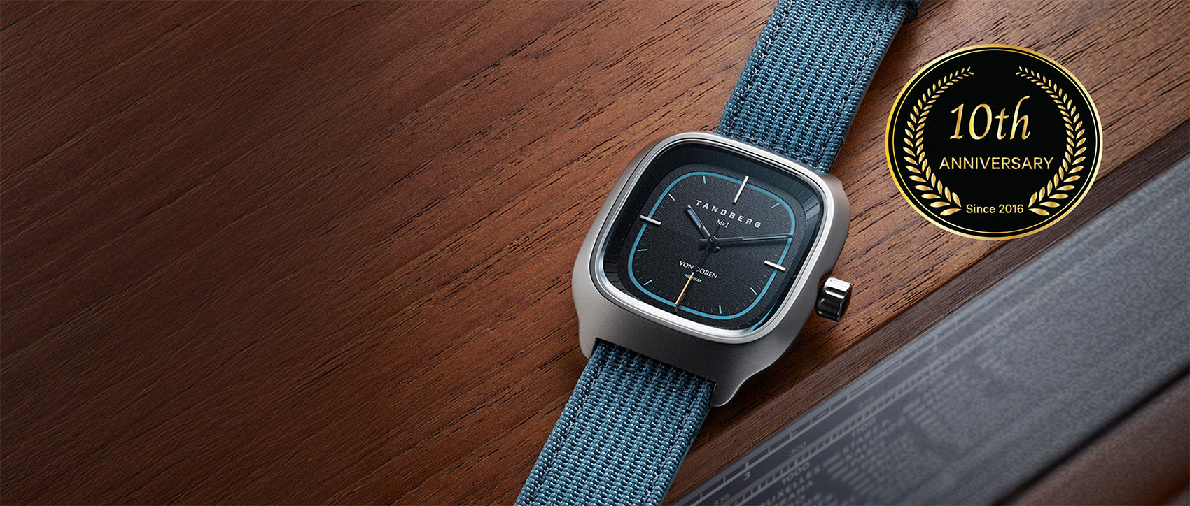 Von Doren Tandberg watch, with black dial and blue strap.